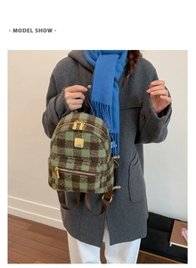Close-up of a mini checkered backpack in green and brown wool on a model for daily use