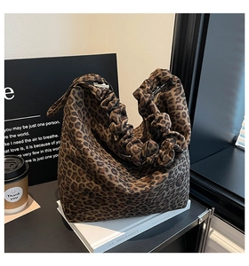 Close-up of leopard print tote bag with stylish scrunchie handle and large capacity