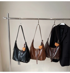 Three leather hobo bags in black, tan and coffee brown with cute bear charms