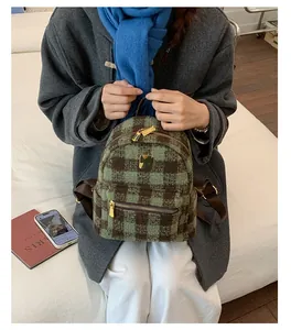 Top-down view of a mini plaid wool backpack with green and brown checkered pattern