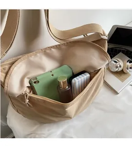 Interior detail of nylon hobo bag showing spacious capacity for tablets and essentials