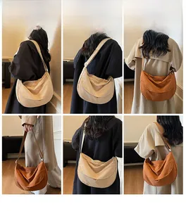 Detail showing versatile beige and rust brown canvas hobo bags worn across the body