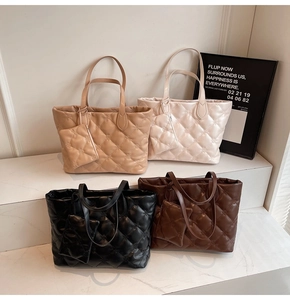 Close-up of quilted tote bags with mini pouches in khaki, beige, black and coffee colors