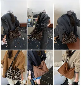 Detail view of large suede tote bags featuring leopard print and textured brown leather