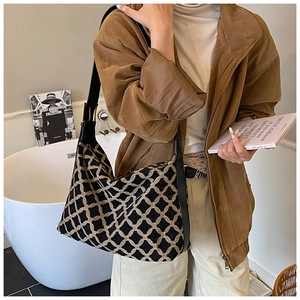 Minimalist large tote bag with geometric rhombus pattern and black leather strap detail