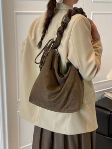 Brown oversized faux suede hobo bag with unique gathered shoulder strap and zipper detail