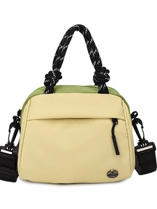 Minimalist beige and green patchwork tote bag with woven rope handles and shoulder strap