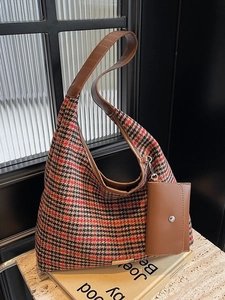 Vintage red and black plaid tote bag with brown leather straps and a matching mini pouch