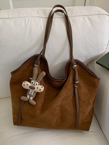 Brown faux suede leopard tote bag with leather straps and a cute plush bunny pendant