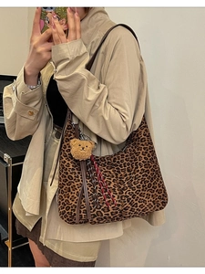 Retro leopard print shoulder bag with brown leather strap and plush bear charm