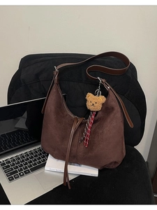 Retro dark brown suede hobo bag with teddy bear charm and fringe details for school