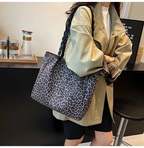 Detail of the leopard print canvas tote bag with durable black braided rope handles