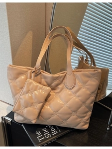 Quilted apricot tote bag with flower stitching and matching mini coin purse charm
