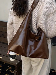 Vintage dark brown large tote bag with glossy finish and white stitching details