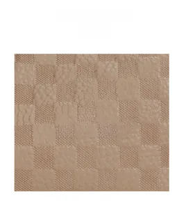Macro shot of light brown checkered embossed leather texture with grainy pebble finish