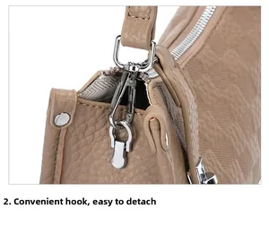 Detail of silver detachable metal hook and hardware on vintage checkered handbag