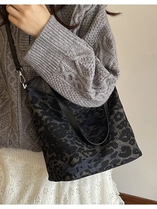 Large leopard print canvas tote bag with black leather straps for daily commute