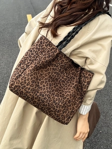 Vintage leopard print oversized tote bag with black woven handles and canvas finish