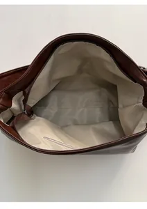 Top view of large tote bag interior showing spacious lining and secure zipper pocket