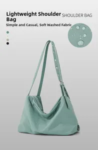 Detail showing waterproof washed fabric and adjustable strap of this casual mint hobo bag