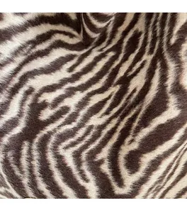 Close-up of zebra pattern faux fur texture on a fashion shoulder tote bag