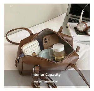 Detailed internal capacity of a brown vintage tote bag showing daily essentials