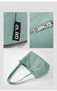 Detailed views of light green nylon tote with silver zipper and woven logo label