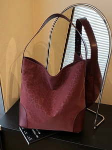 Large burgundy leopard print tote bag in premium suede with leather straps and minimalist style