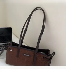 Close-up of leopard print shoulder bag with adjustable straps and Sunny Day label