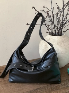 Vintage black faux leather hobo bag with adjustable wide strap and silver metal hardware