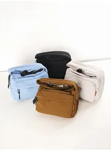 Waterproof nylon crossbody bags in blue, black, beige, and brown with front zipper pockets