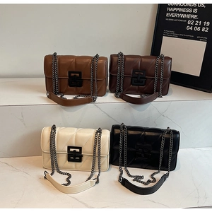 Detailed display of four quilted chain crossbody bags in brown, white, and black colors