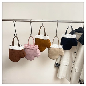 Collection of five suede glove-shaped handbags with faux fur trim in various colors