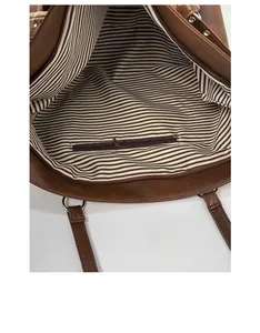 Detail view of the large capacity tote bag with striped lining and internal zipper pocket