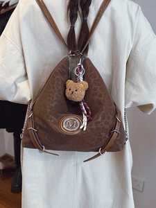 Vintage leopard print tote backpack in dark brown faux leather with metallic M logo