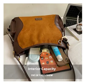 Detailed view of the brown suede tote bag interior showcasing large storage capacity