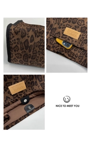 Detail view of leopard print tote bag with magnetic closure and inner pocket