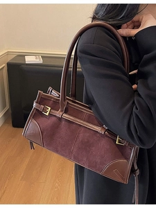 Chic burgundy suede and brown leather shoulder bag with vintage metal buckle