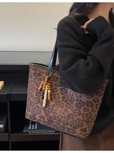 Minimalist brown leopard print tote bag with wooden bead tassel and black leather trim