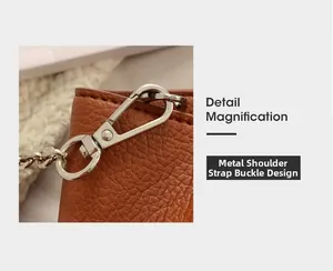 Close-up of silver metal strap buckle on premium brown pebble grain leather bucket bag