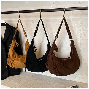 Three large capacity matte crossbody dumpling bags in yellow, black and dark brown colors