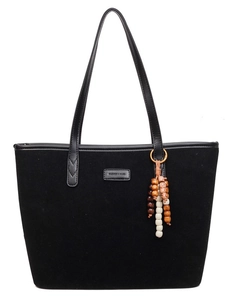 Black tote bag in matte suede leather with decorative ethnic beaded tassel ornament