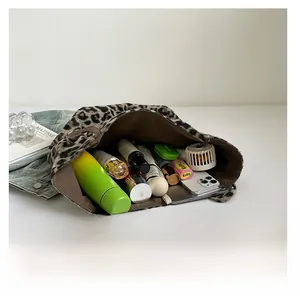 Top view of large zebra print tote bag interior showing spacious storage and essentials