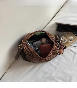 Spacious interior of leopard print hobo bag showing capacity for daily essentials