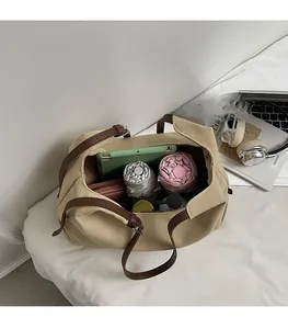 Interior view showing the large capacity of a canvas tote bag with various daily essentials