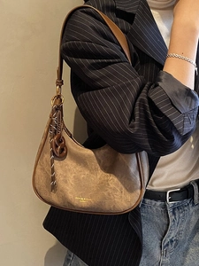 Brown suede hobo underarm bag with moon shape and gold lettering for women