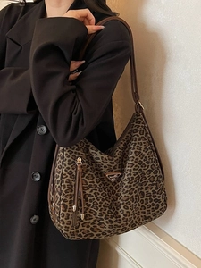 Classic leopard print crescent shoulder bag with metallic logo and tassel detail