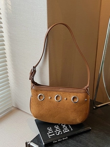 Vintage brown suede underarm bag with silver eyelets and adjustable leather strap