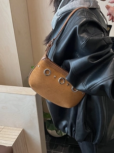 Brown suede minimalist underarm bag featuring vintage metal ring decor and studs