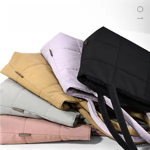 Quilted puffer tote bags in five colors showing the high-quality nylon fabric texture